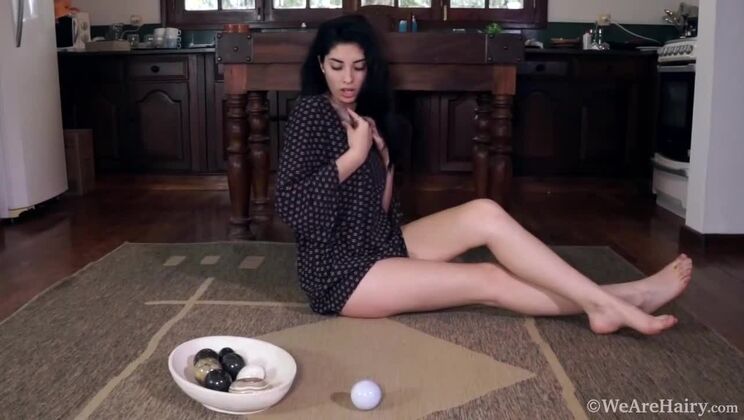 Brunette Ornella masturbates with cold stones on floor